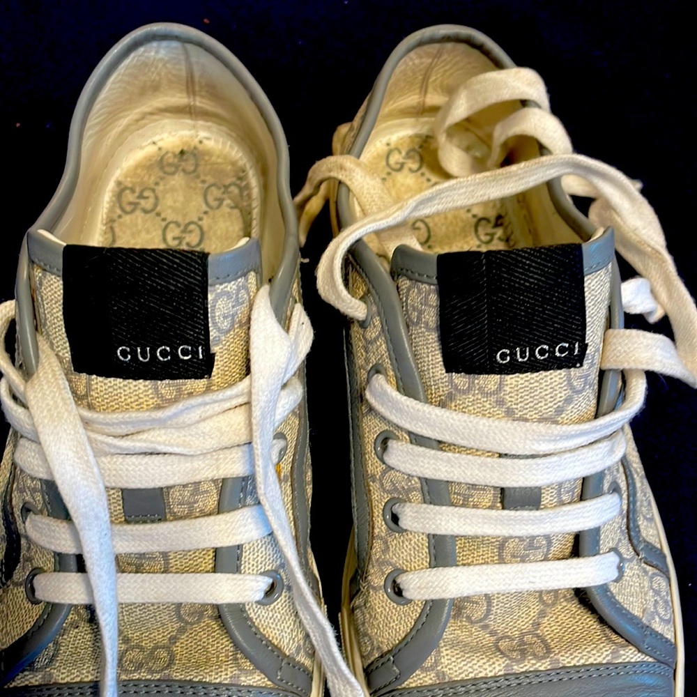 Hugging designer tennis shoes
